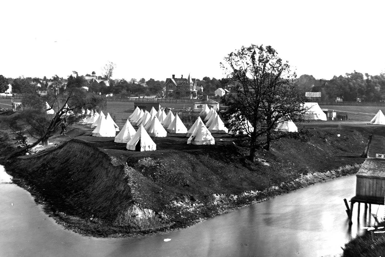 A military encampment at Tecumseh Park, c. 1885. Tecumseh Park has been a military reserve since 1794 when Simcoe ordered the establishment of a shipyard on this site.