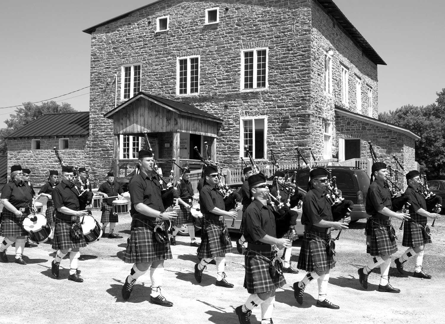 Parading into the Spencerville Mill grounds is the Glengarry Pipe Band (Photo: The Spencerville Mill Foundation)