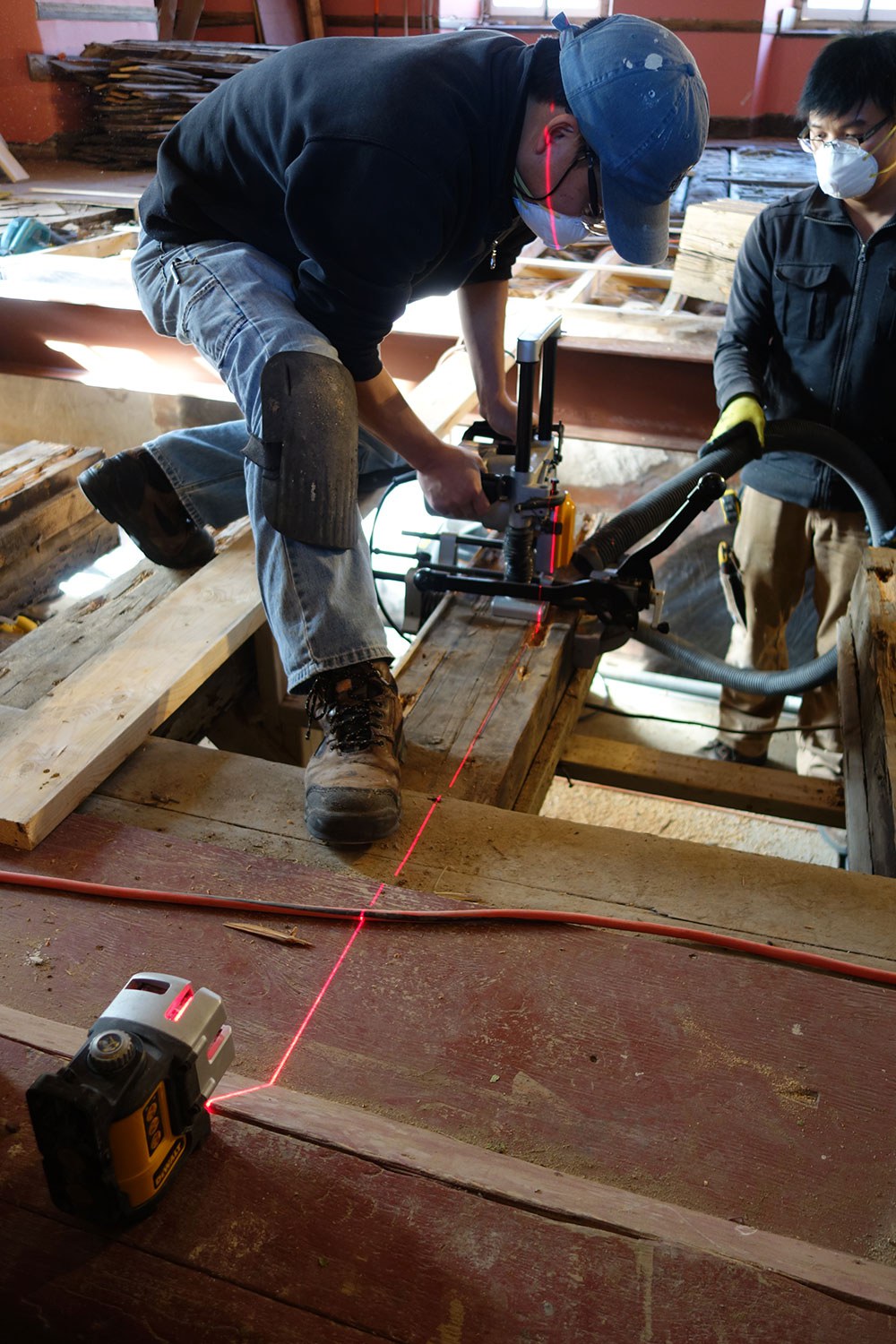 Routing out slots in old timbers using a precision guided electric chain router