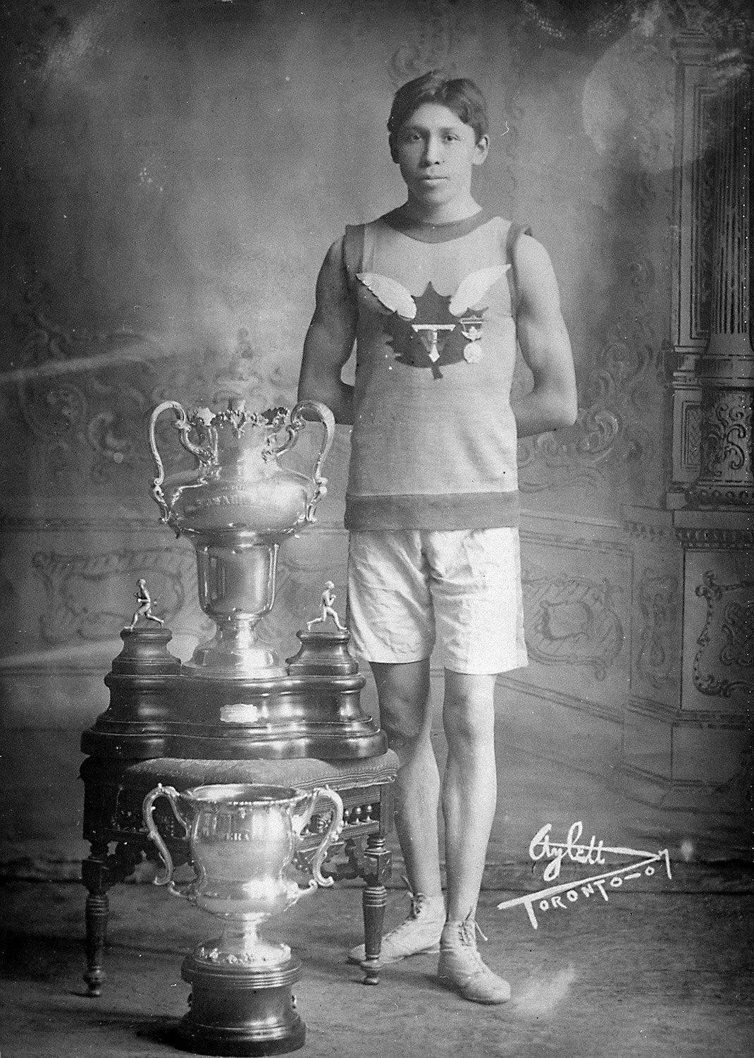 Tom Longboat with running trophies (April 22, 1907). Photo courtesy of Library and Archives Canada.