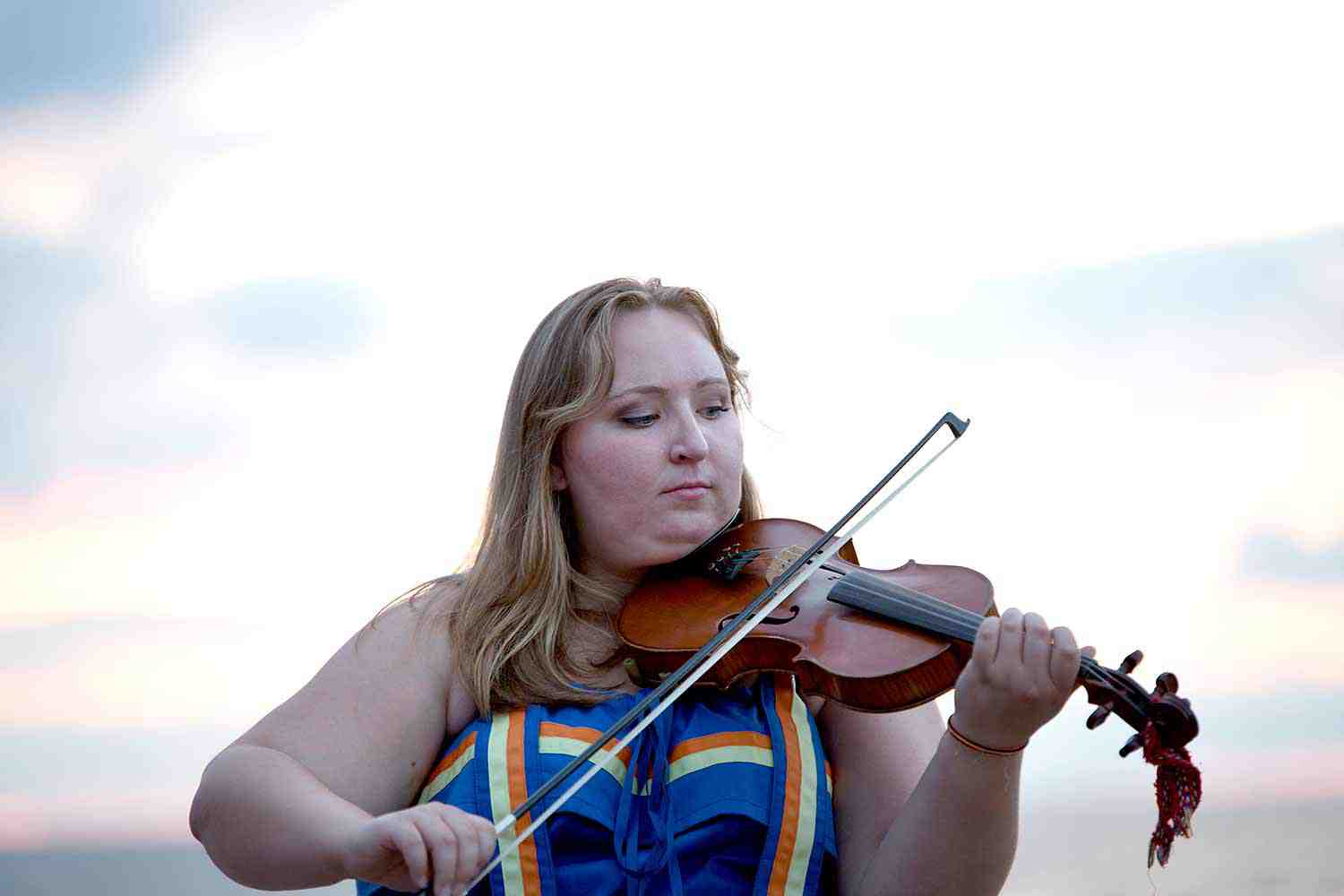 Métis Nation of Ontario woman playing the fiddle (Photo: Métis Nation of Ontario)