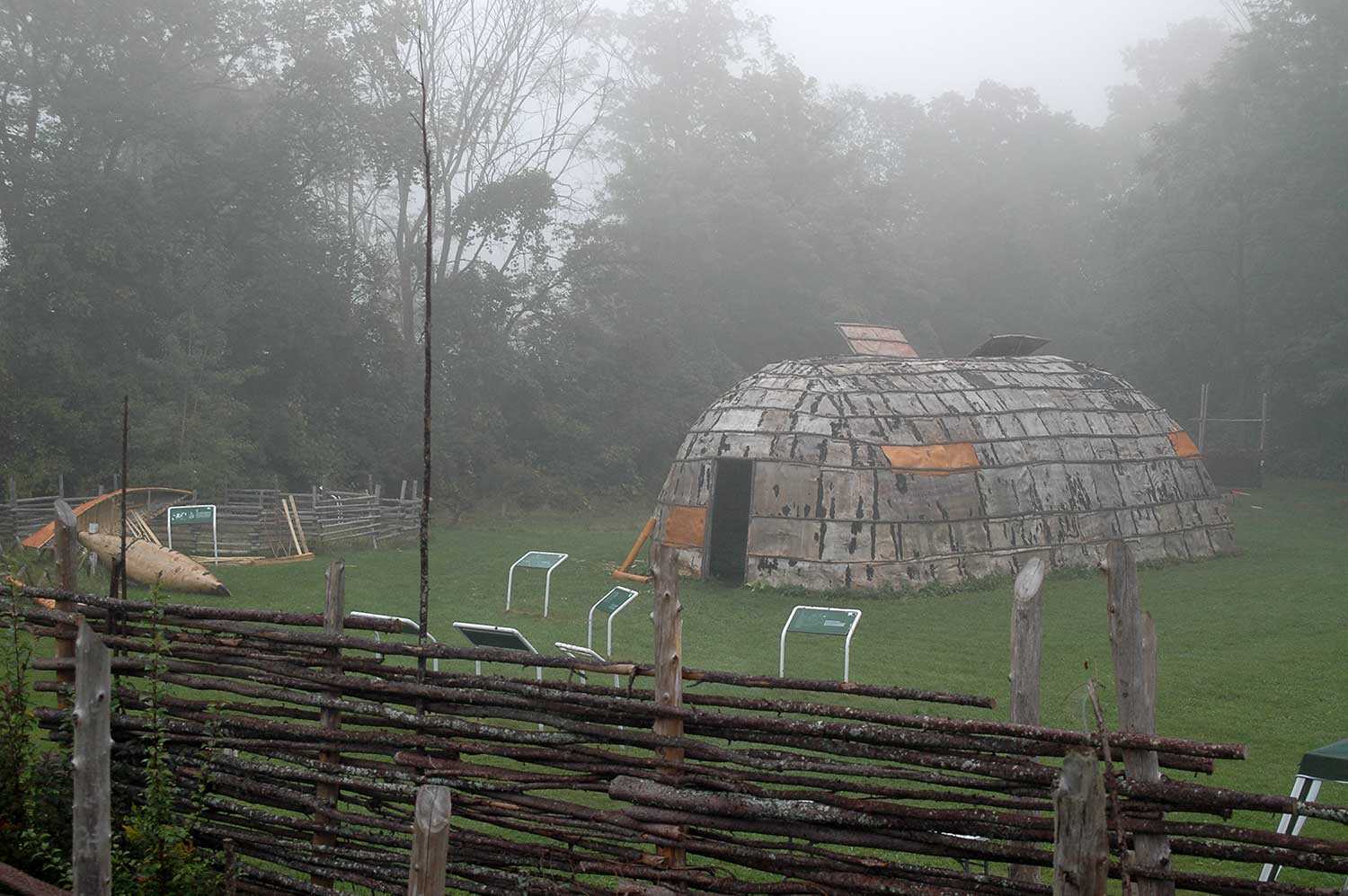 Reconstructed longhouse and palisade at the Lawson site