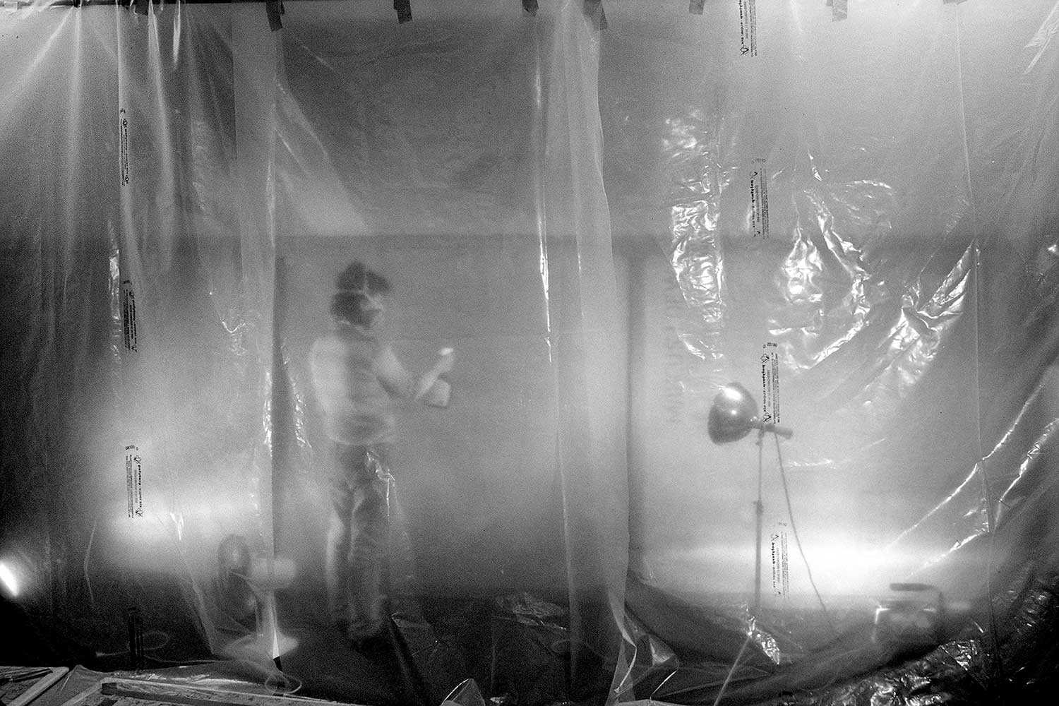 Head conservator, Janice Passafiume, in dehumidification chamber treating the cockling and rippling of the canvas