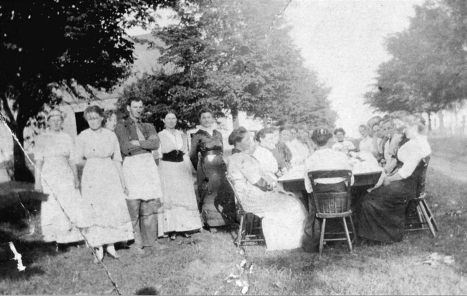 Feast after a quilting bee at Mrs. Burts, Erin Township, 1915. (Ph 10312, Wellington County Museum and Archives)